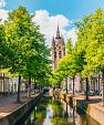 Gracht met scheve kerktoren, Oude Kerk, Delft