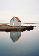Weerspiegeling huis in meer